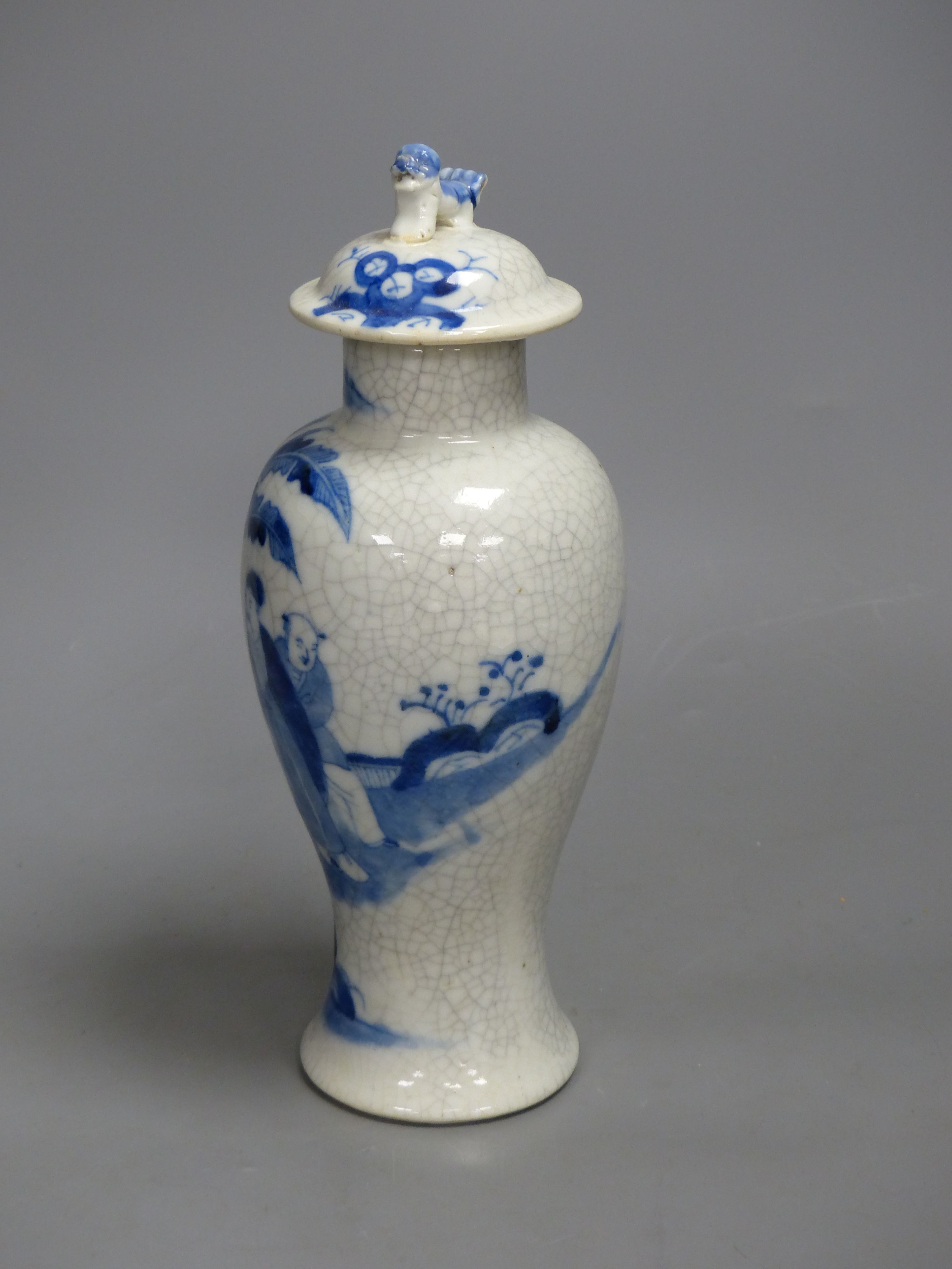 A late 19th century Chinese blue and white crackle glaze vase and cover, height 27cm